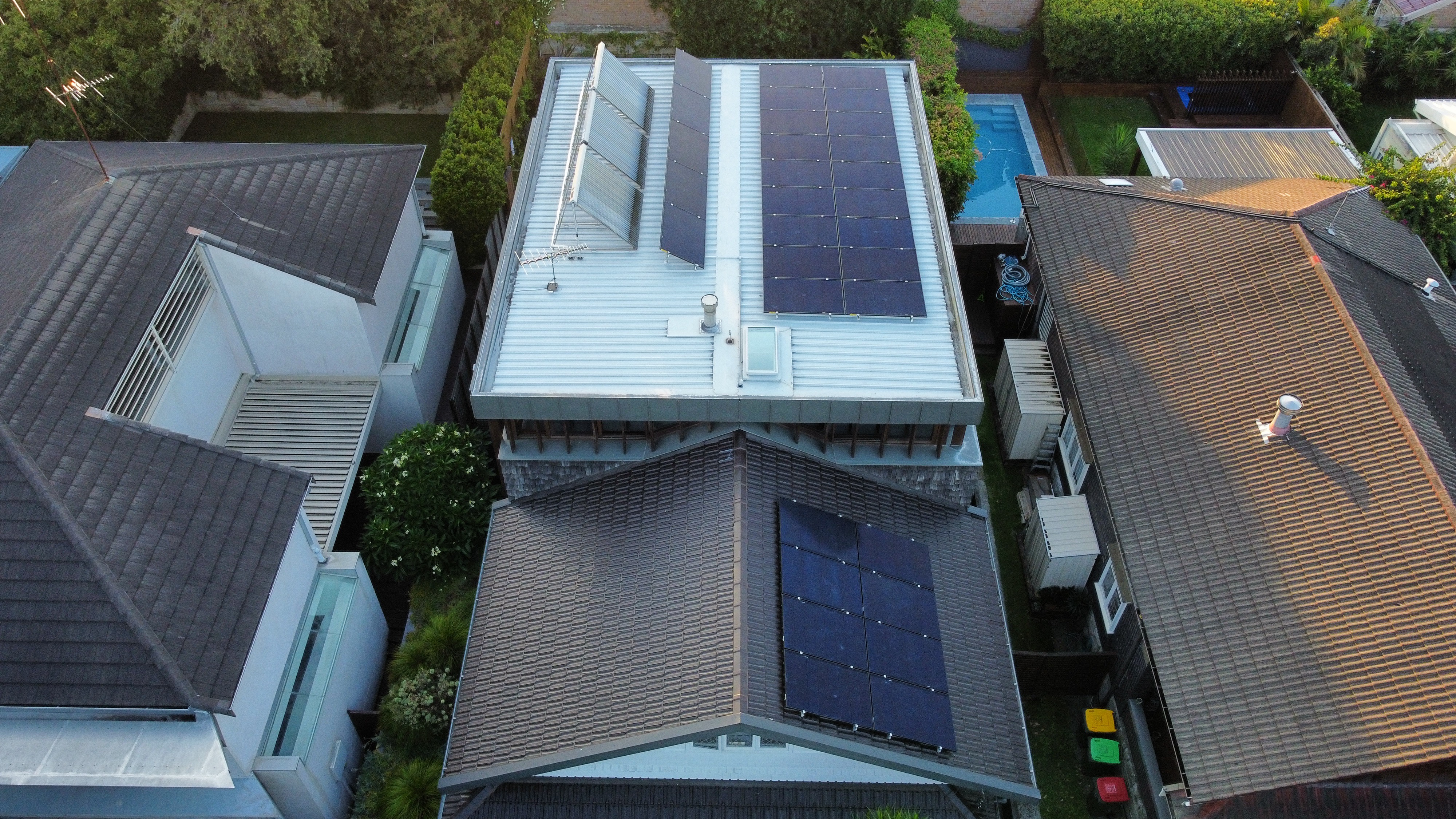 Aerial view of a Coogee NSW home with solar arrays across two roof sections, part of a 12.71 kW solar and battery installation